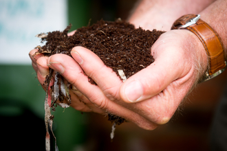 Hands holding soil