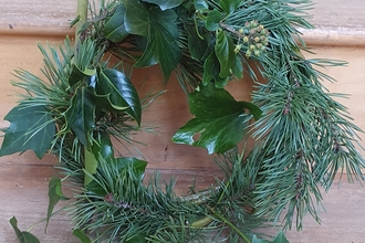 Green wreath on bench