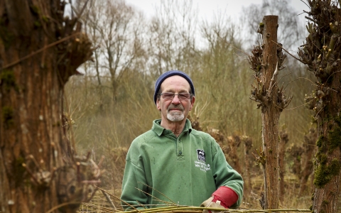 Malcolm volunteering on a reserve