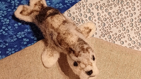 A needle-felted seal