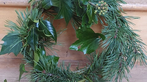 Green wreath on bench